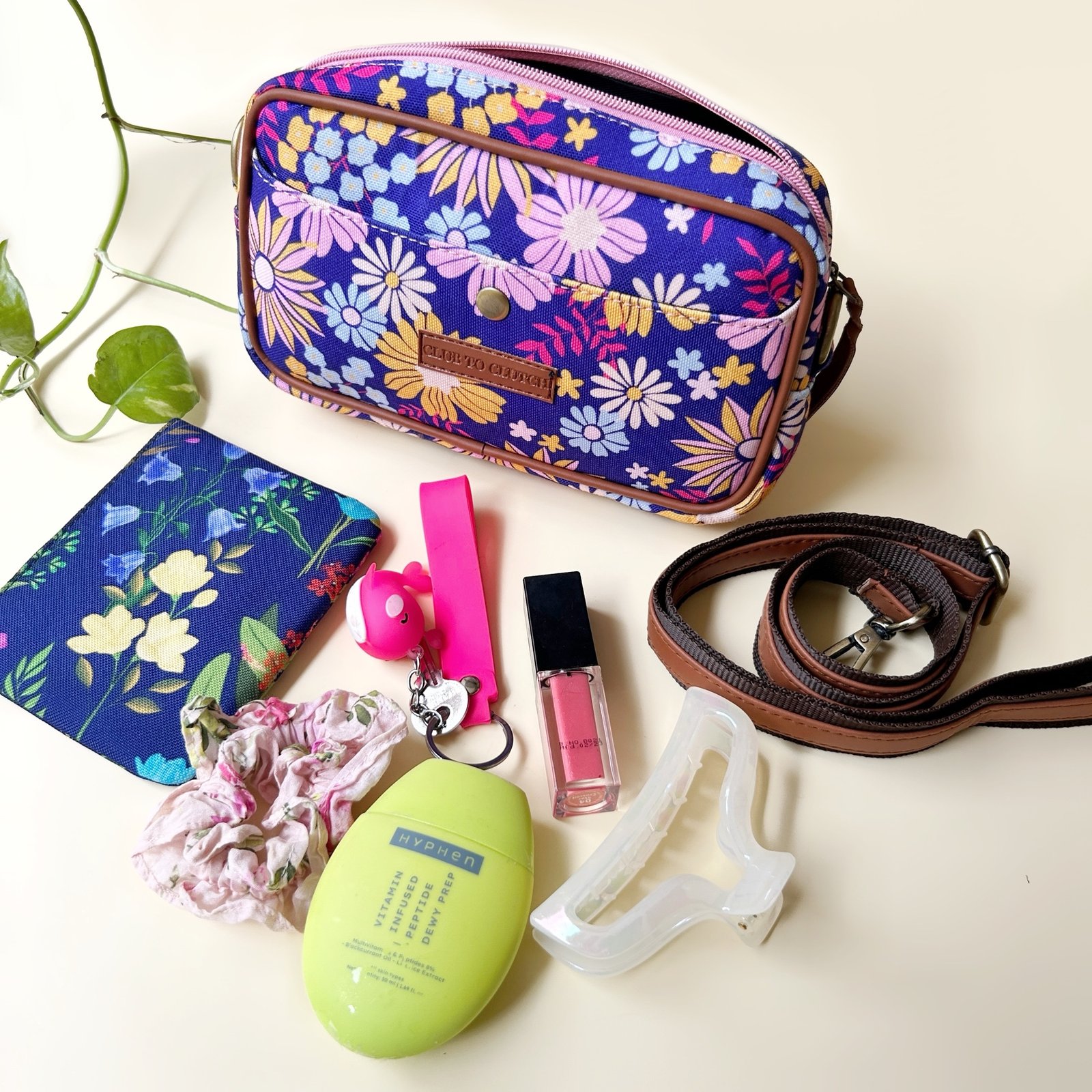 Interior of Flora Charm Sling Bag showing capacity for phone, wallet, and essentials.