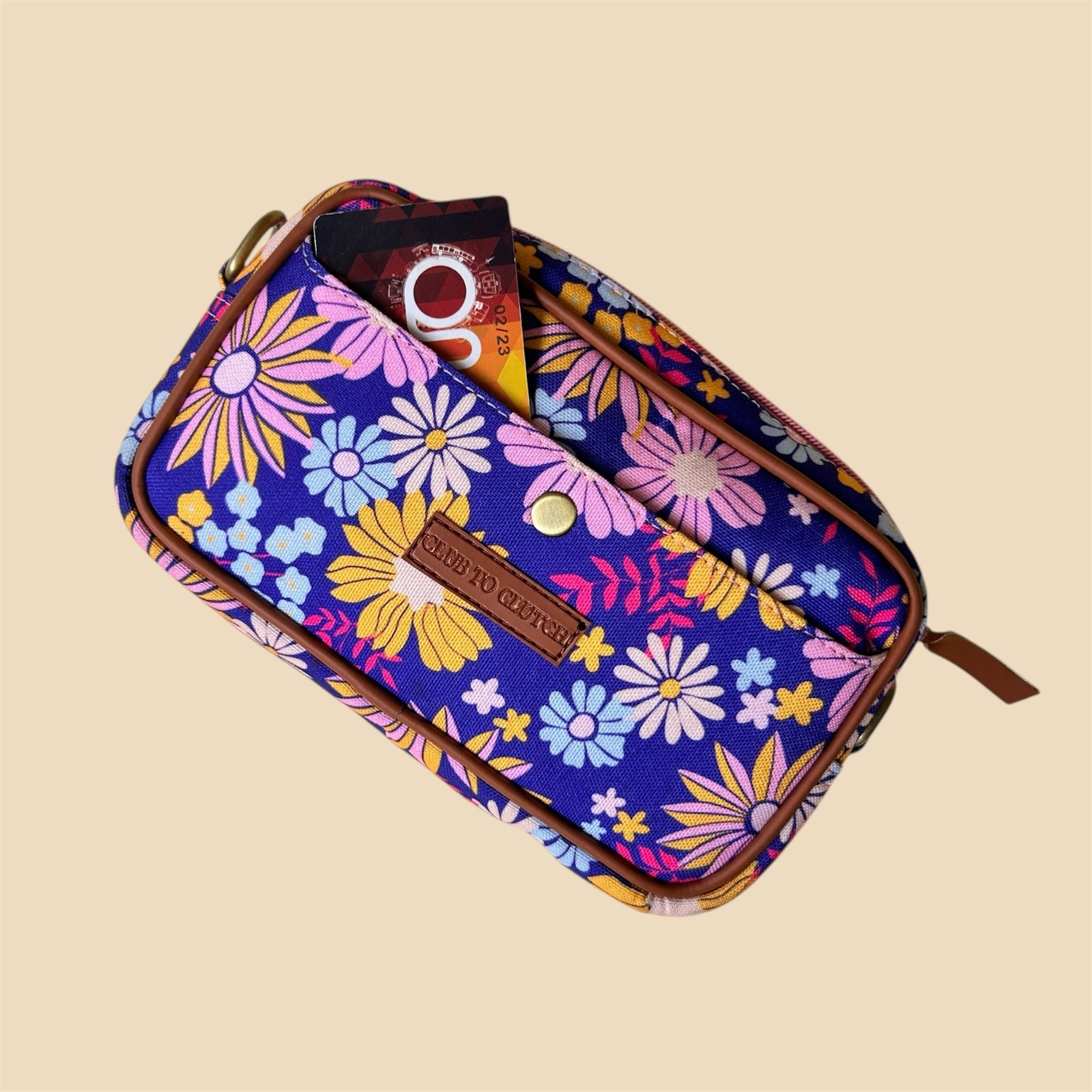 Top view of Flora Charm Printed Sling Bag - Zipper closure and depth of small crossbody.